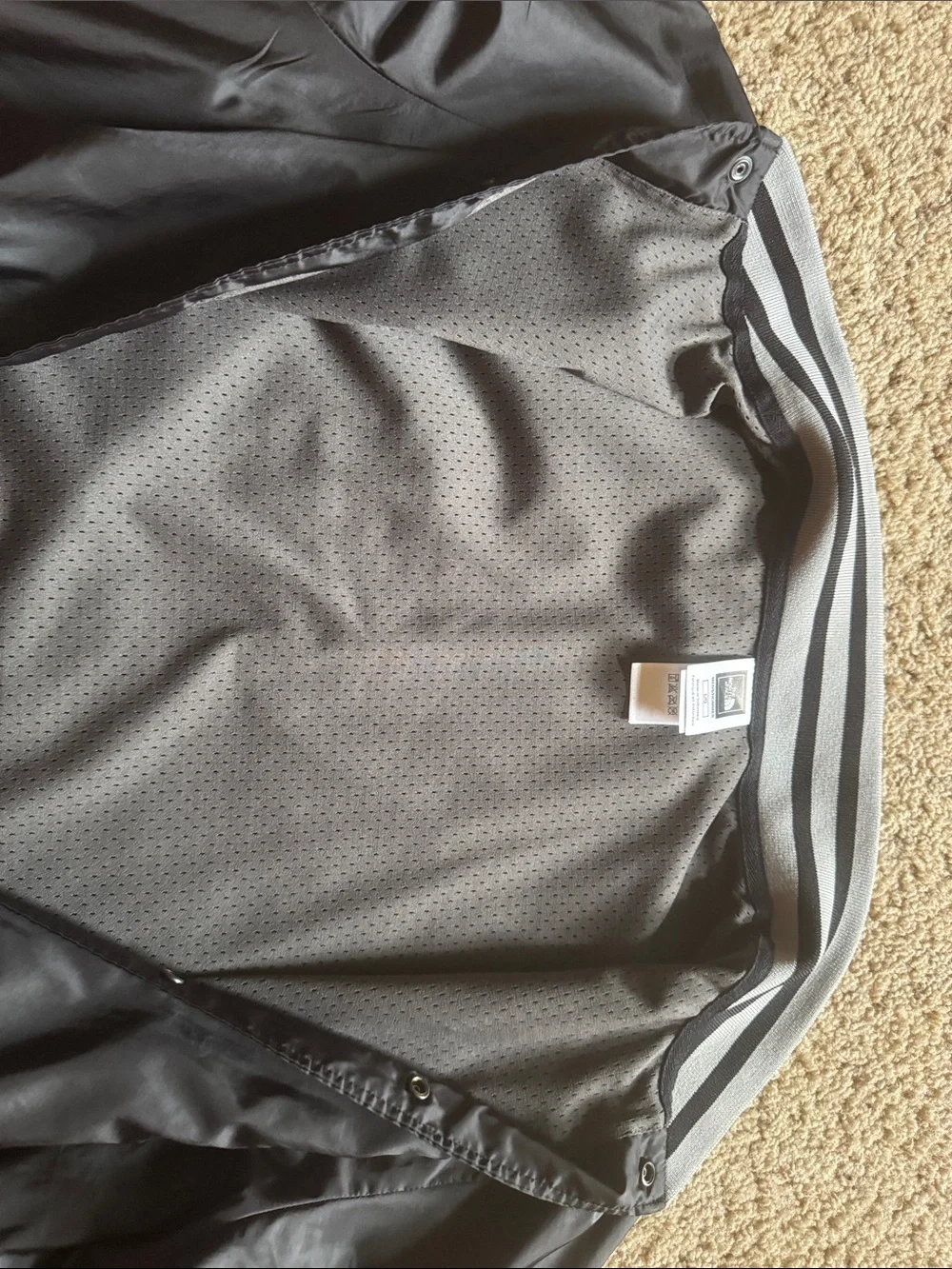 The North Face Black Bomber Jacket with Gray/Black Striped Trim
